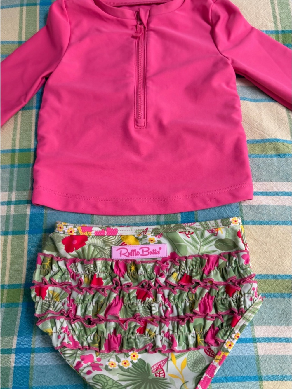 Ruffle Butts pink/green floral swim bottom (3T) with Carters rashguard top (2T)